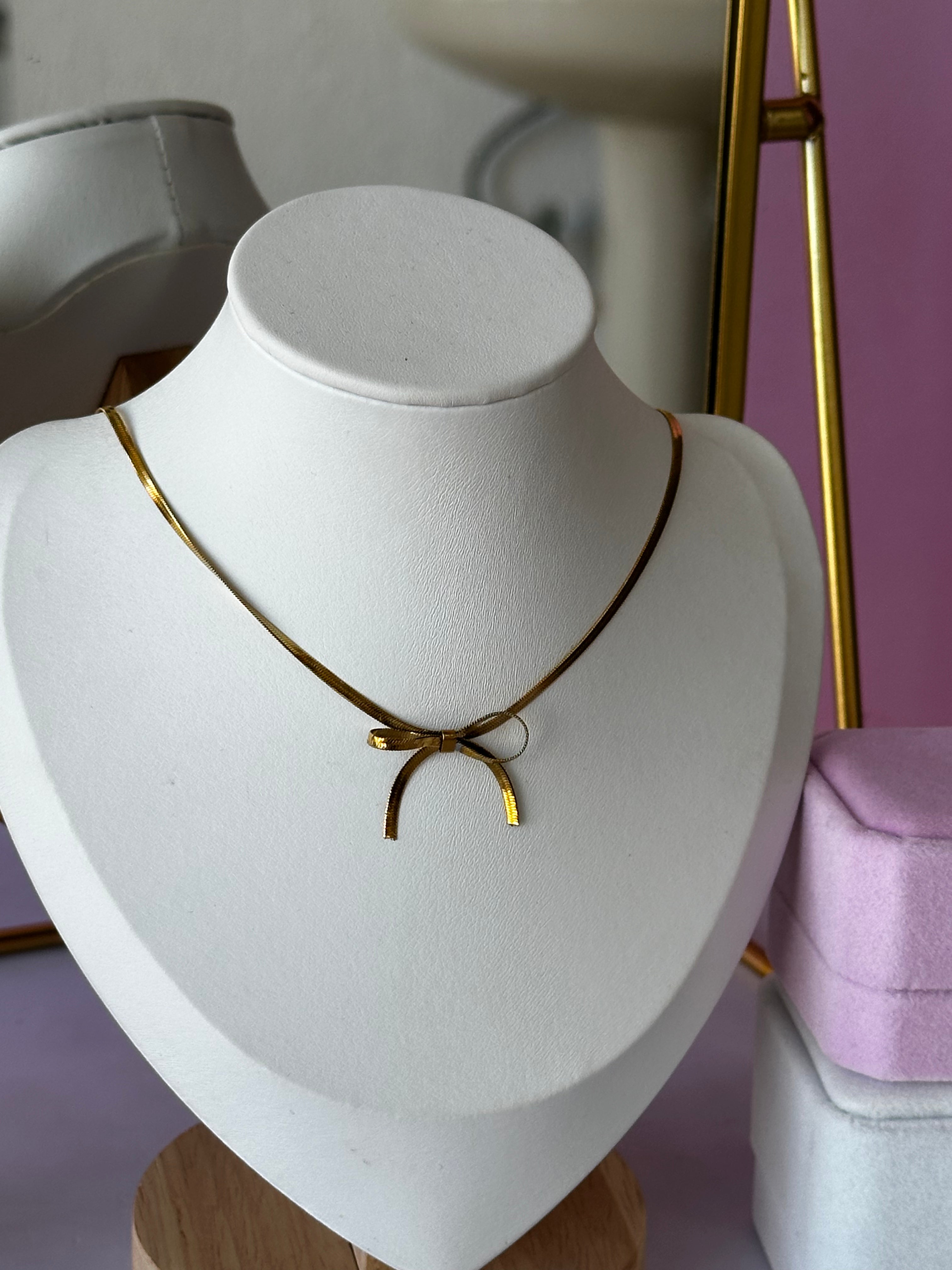 COLLAR EN FORMA DE MOÑO ACERO 316